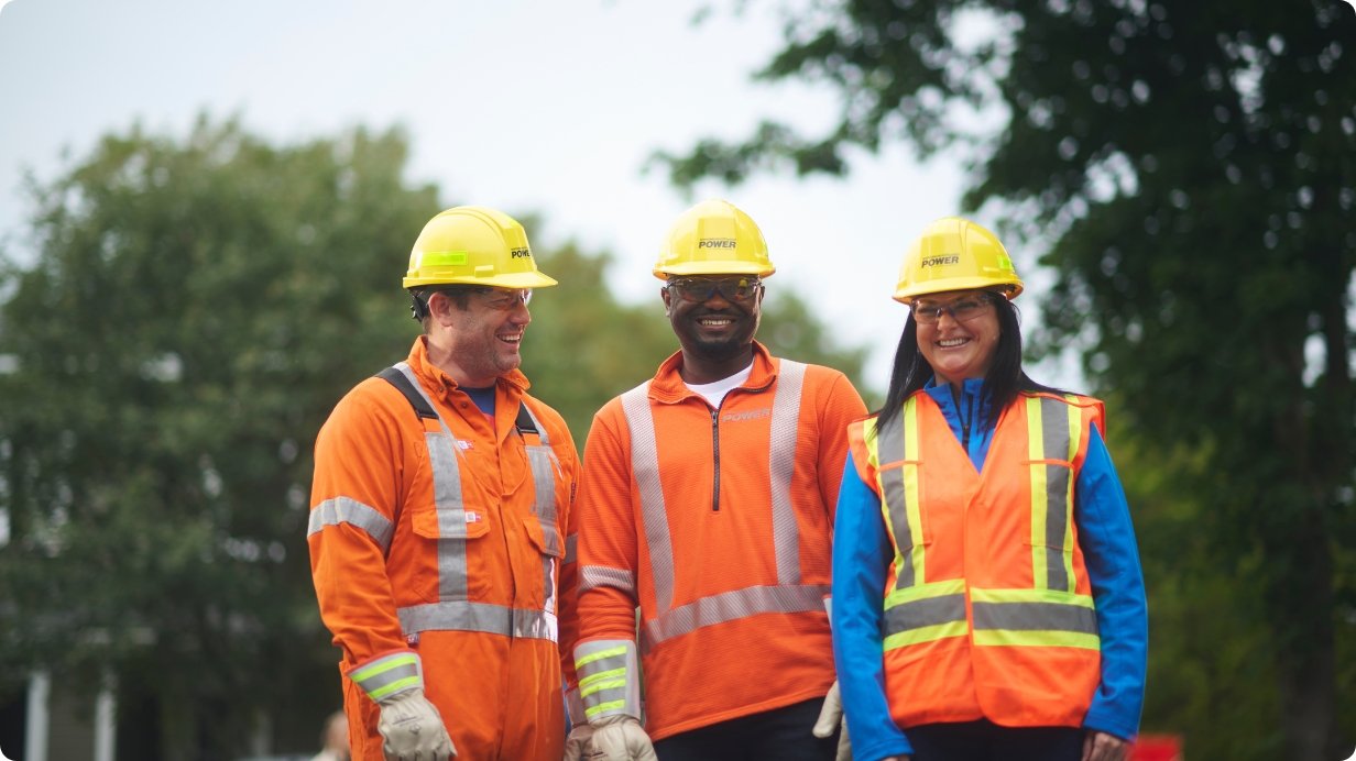 Leading the Way Fortis Companies - Resized 1232 x 692 Employee working on power lines in safety gear